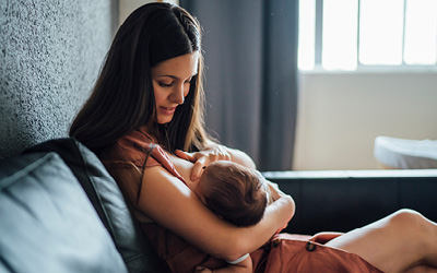 Lactation consultant with new mother and baby.