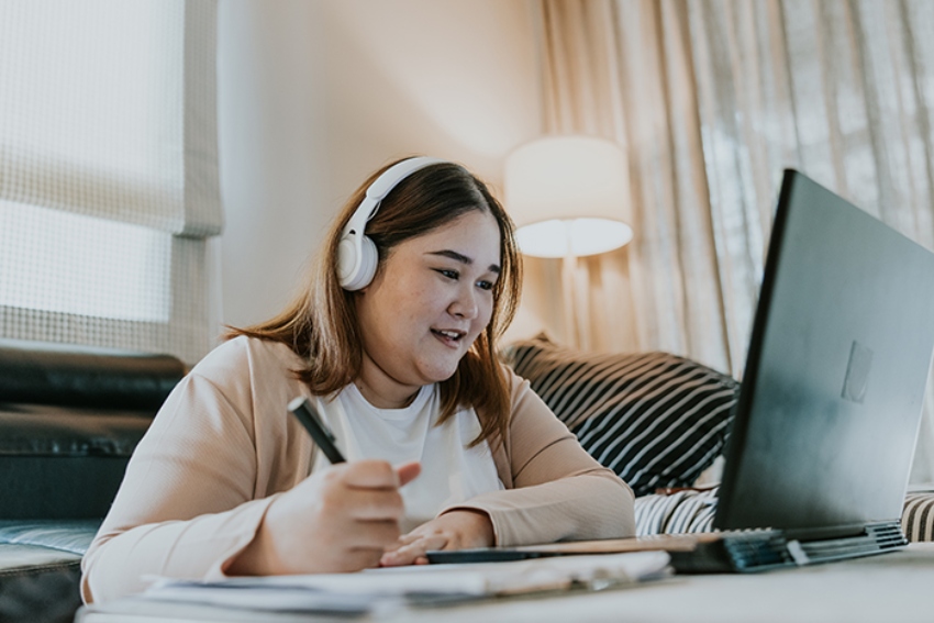 Female student at computer working through an online, self-paced course
