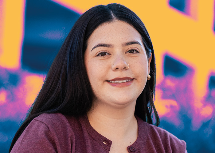 Ammerica Barraza smiling with multicolored background