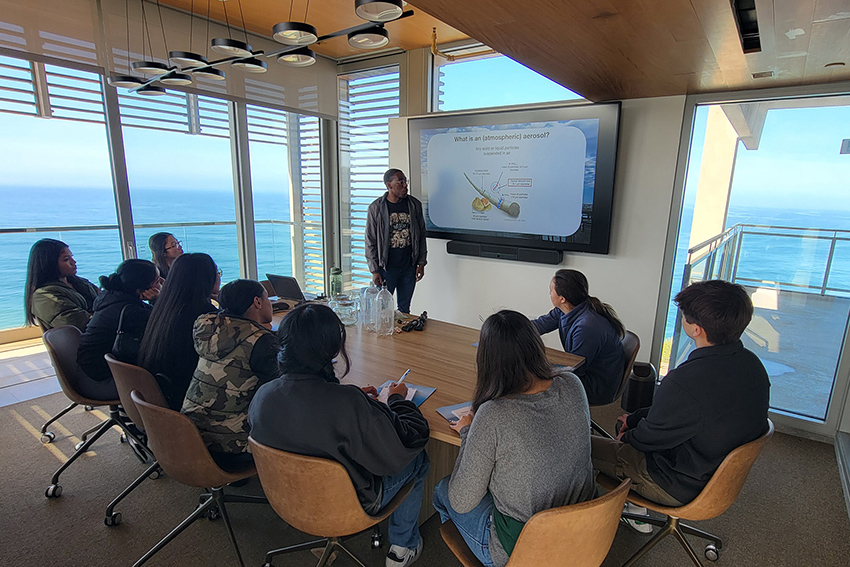 Conservation Leadership students learning about atmospheric aerosols in a classroom overlooking the Pacific Ocean.